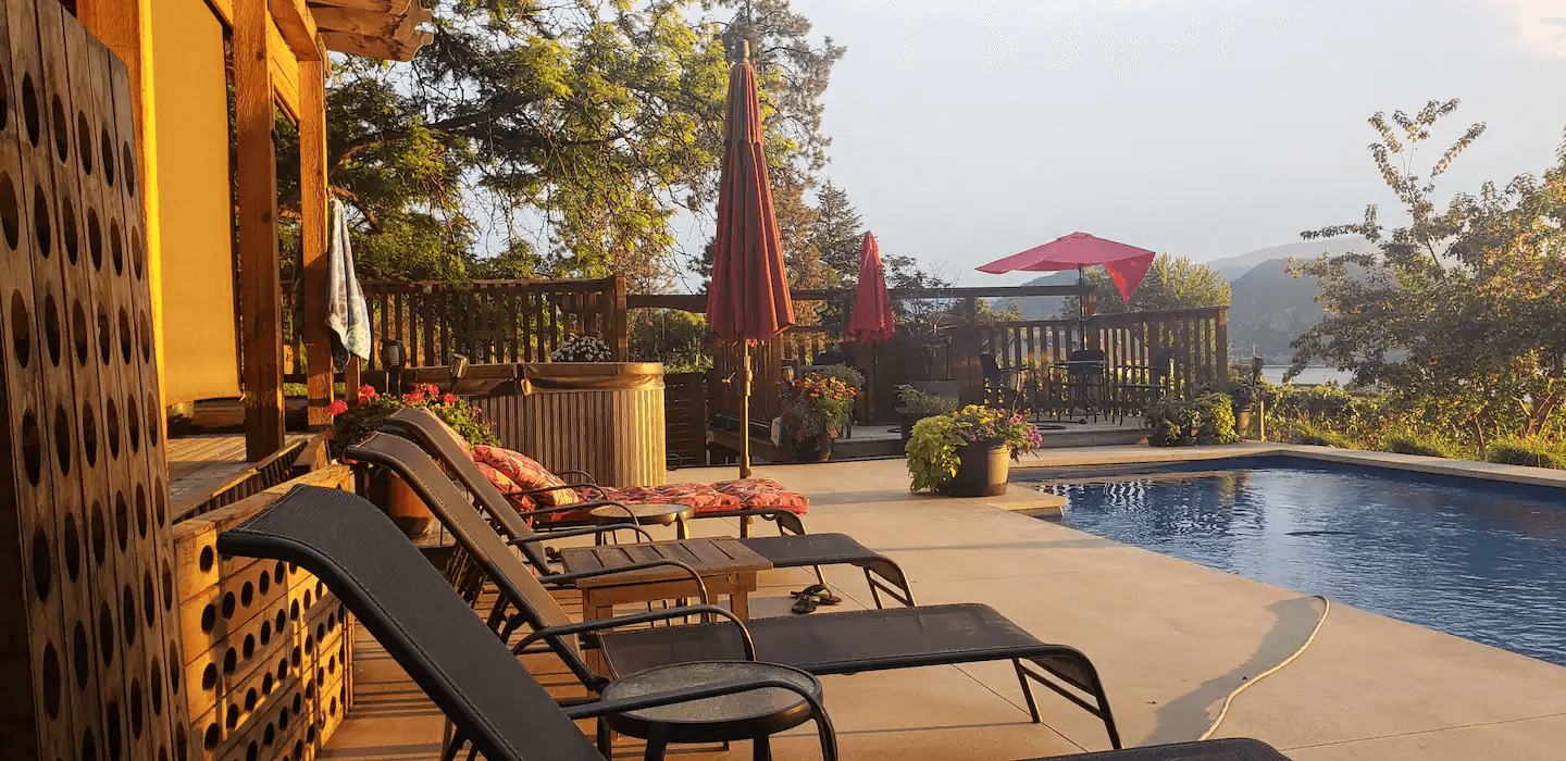 Outdoor seating overlooking vineyard and Okanagan Lake in Naramata BC