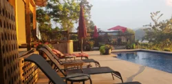 Pool deck lounge chairs overlooking Okanagan Lake