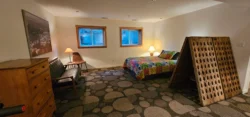 Bedroom with queen bed and rug in the vacation suite